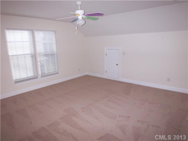 289 Lorraine Road Fort Mill, SC 29708 - Photo 14 of 16 an empty room with windows and fan