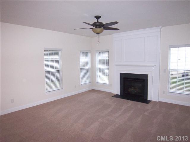 289 Lorraine Road Fort Mill, SC 29708 - Photo 6 of 16 a view of an empty room with a window and a fireplace
