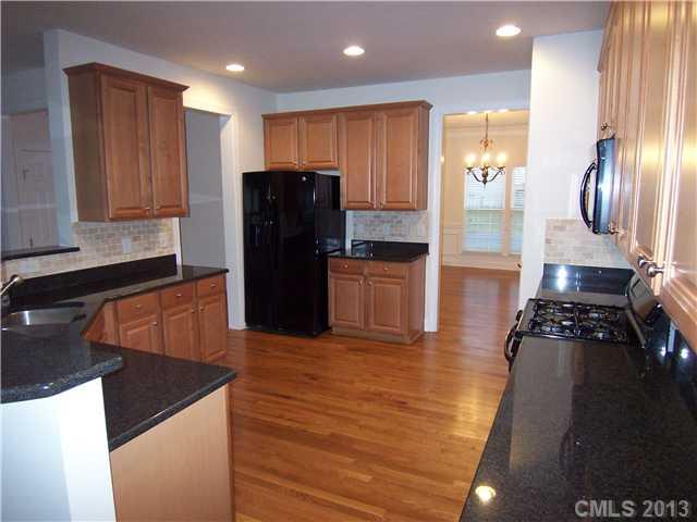 289 Lorraine Road Fort Mill, SC 29708 - Photo 9 of 16 a kitchen with stainless steel appliances granite countertop a refrigerator and a stove top oven