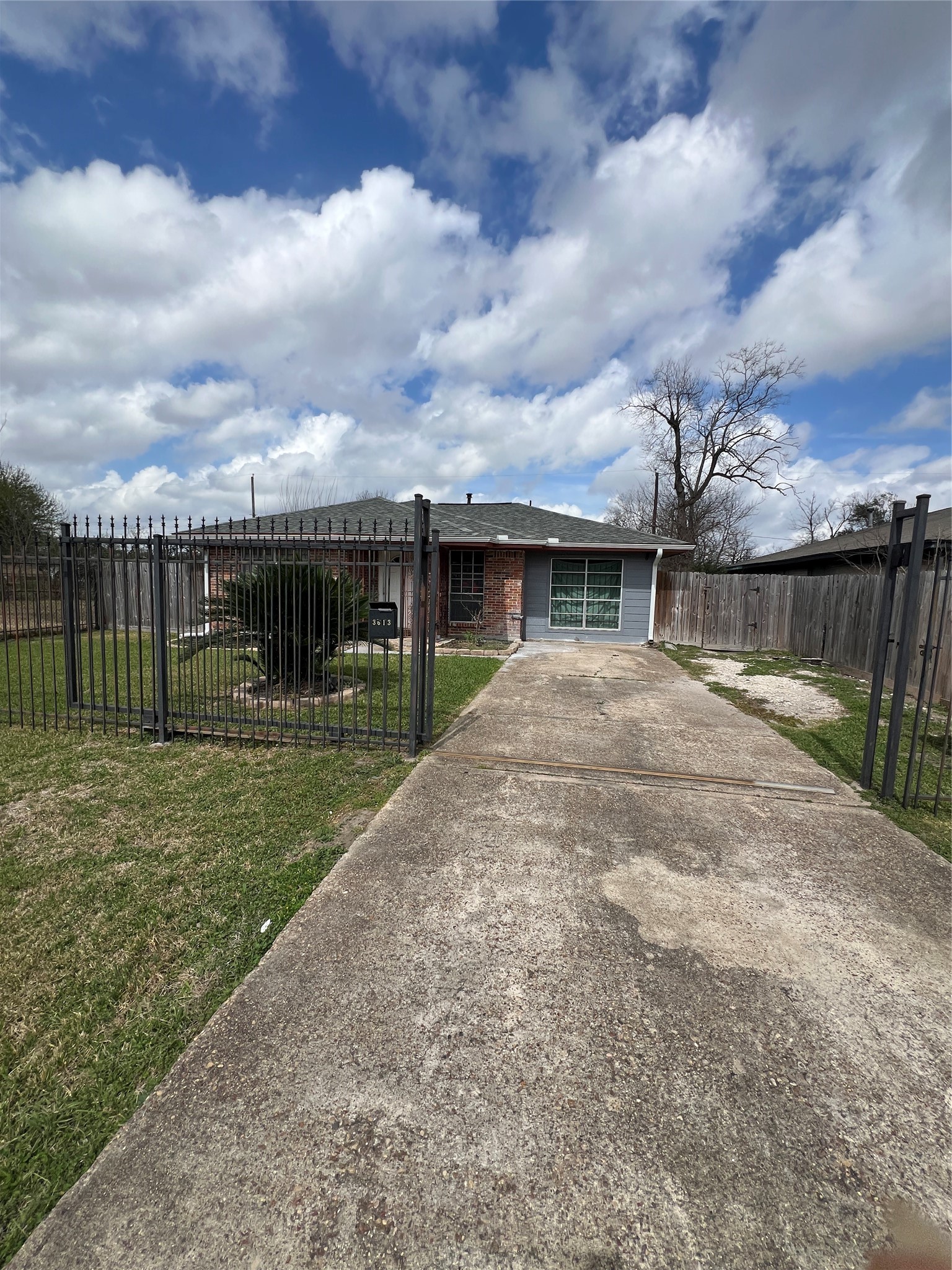3613 Sparrow Street Houston, TX 77051 - Photo 1 of 10 a view of a house next to a lake with a big yard