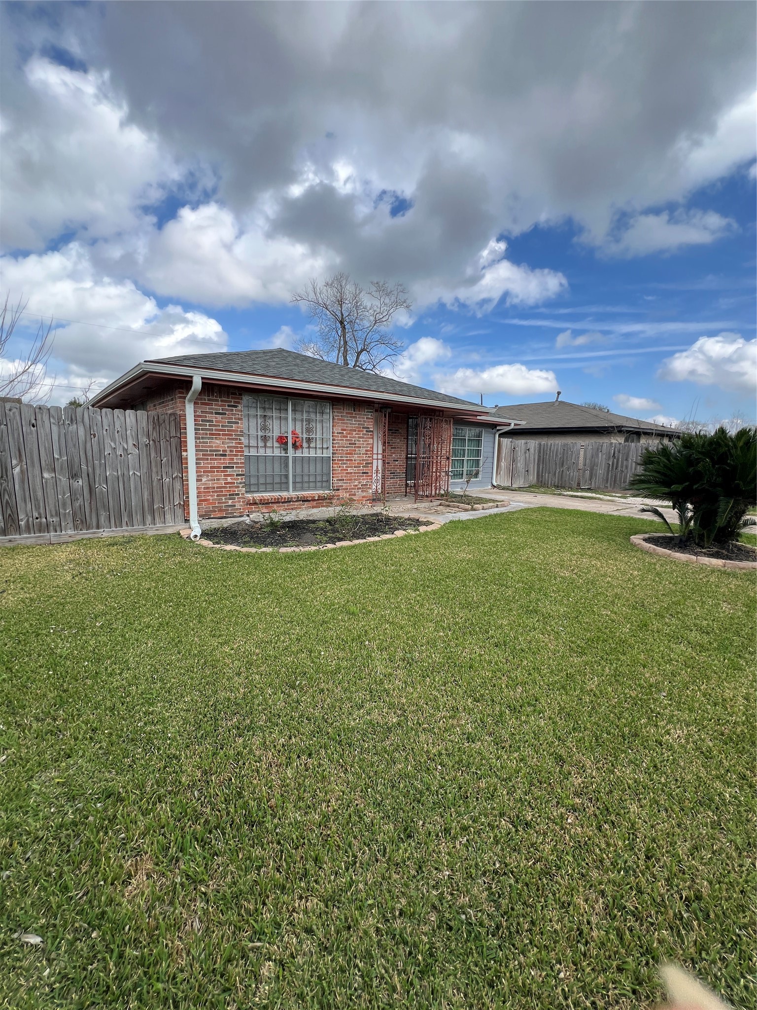3613 Sparrow Street Houston, TX 77051 - Photo 2 of 10 a view of a house with a yard and sitting area