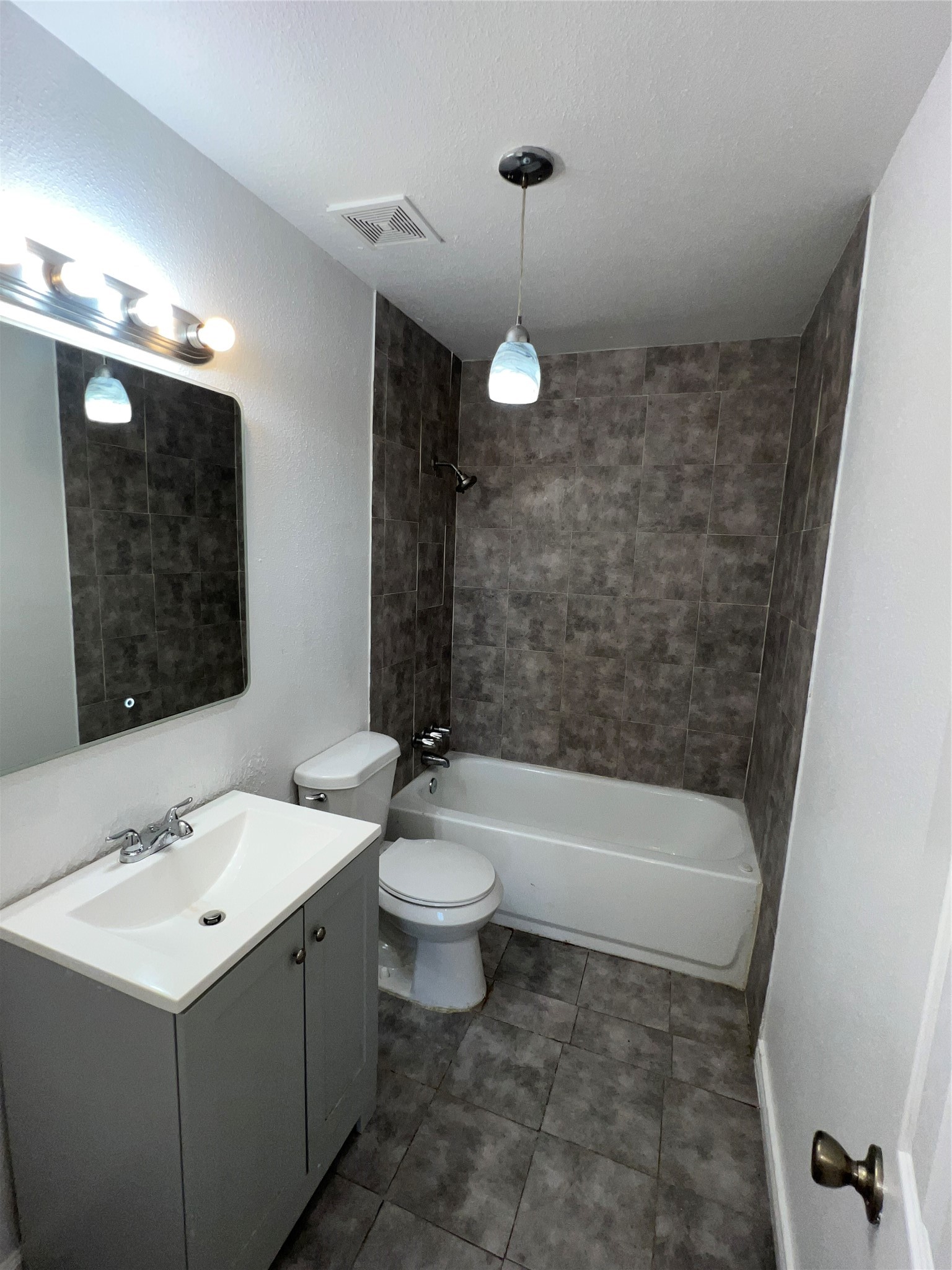 3613 Sparrow Street Houston, TX 77051 - Photo 8 of 10 a bathroom with a sink a toilet and shower