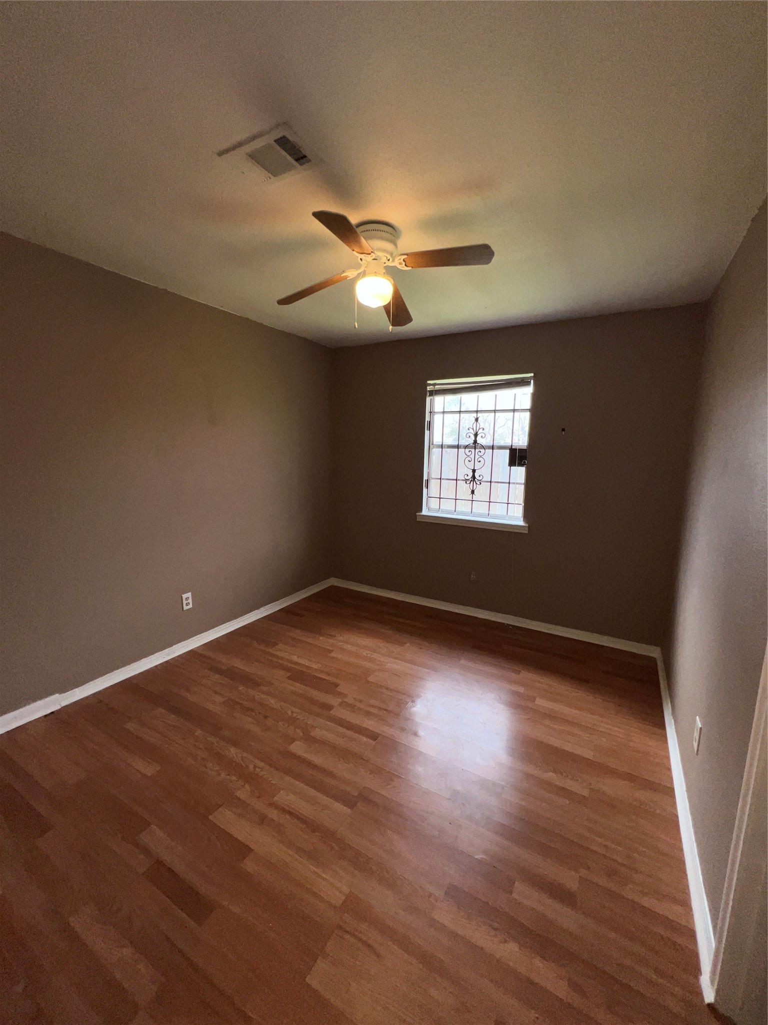 3613 Sparrow Street Houston, TX 77051 - Photo 10 of 10 a view of empty room with wooden floor and fan