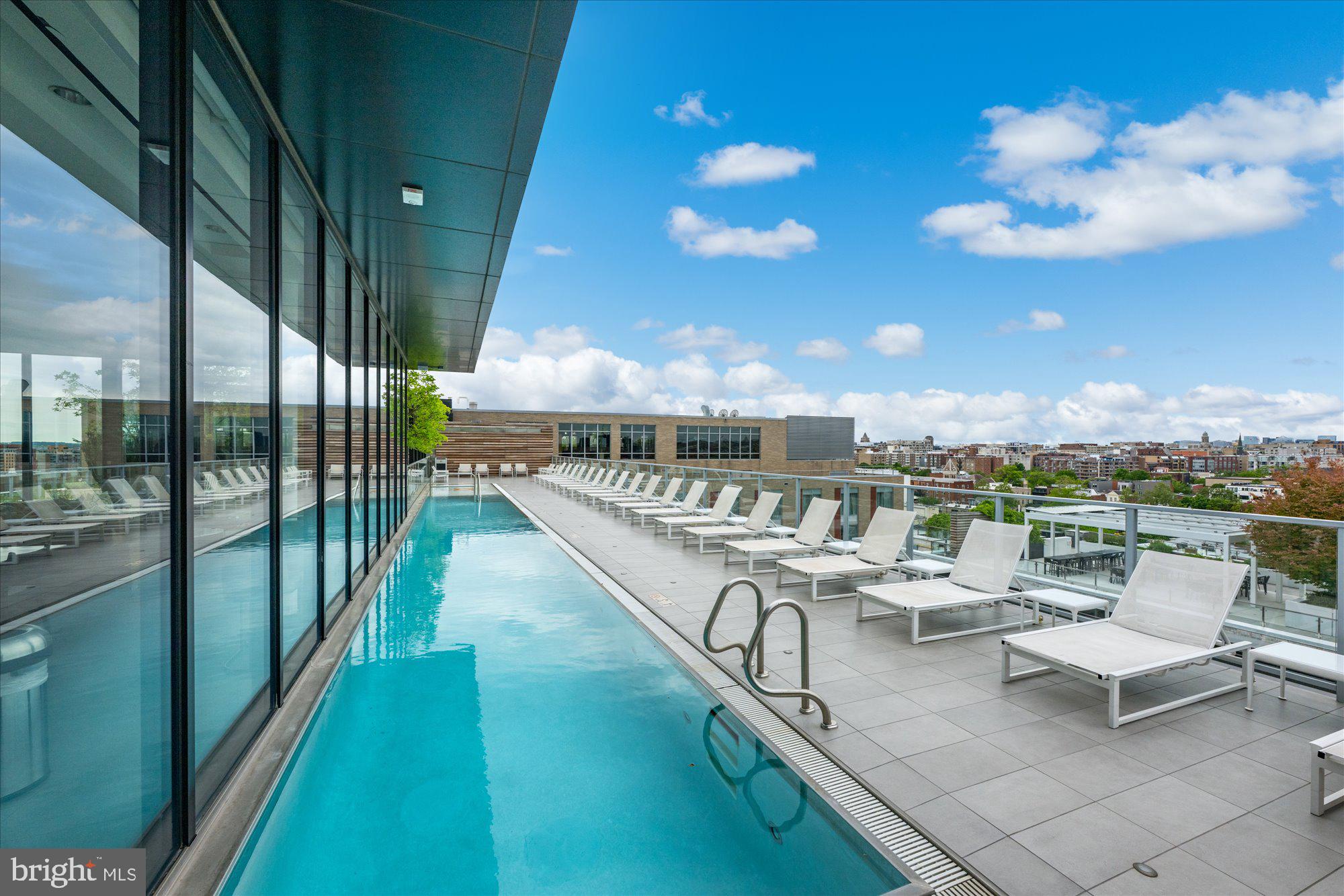 1336 8th Street Northwest, Unit TH5 Washington, DC 20001 - Photo 31 of 32 a roof deck with a table and chairs