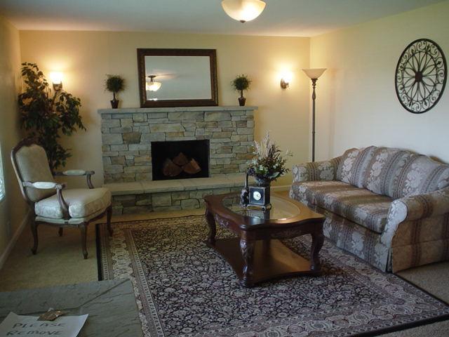 3656 West Birchfield Road Moxee, WA 98936 - Photo 13 of 31 a living room with furniture and a fireplace