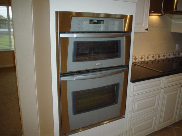3656 West Birchfield Road Moxee, WA 98936 - Photo 8 of 31 a stove top oven sitting inside of a kitchen