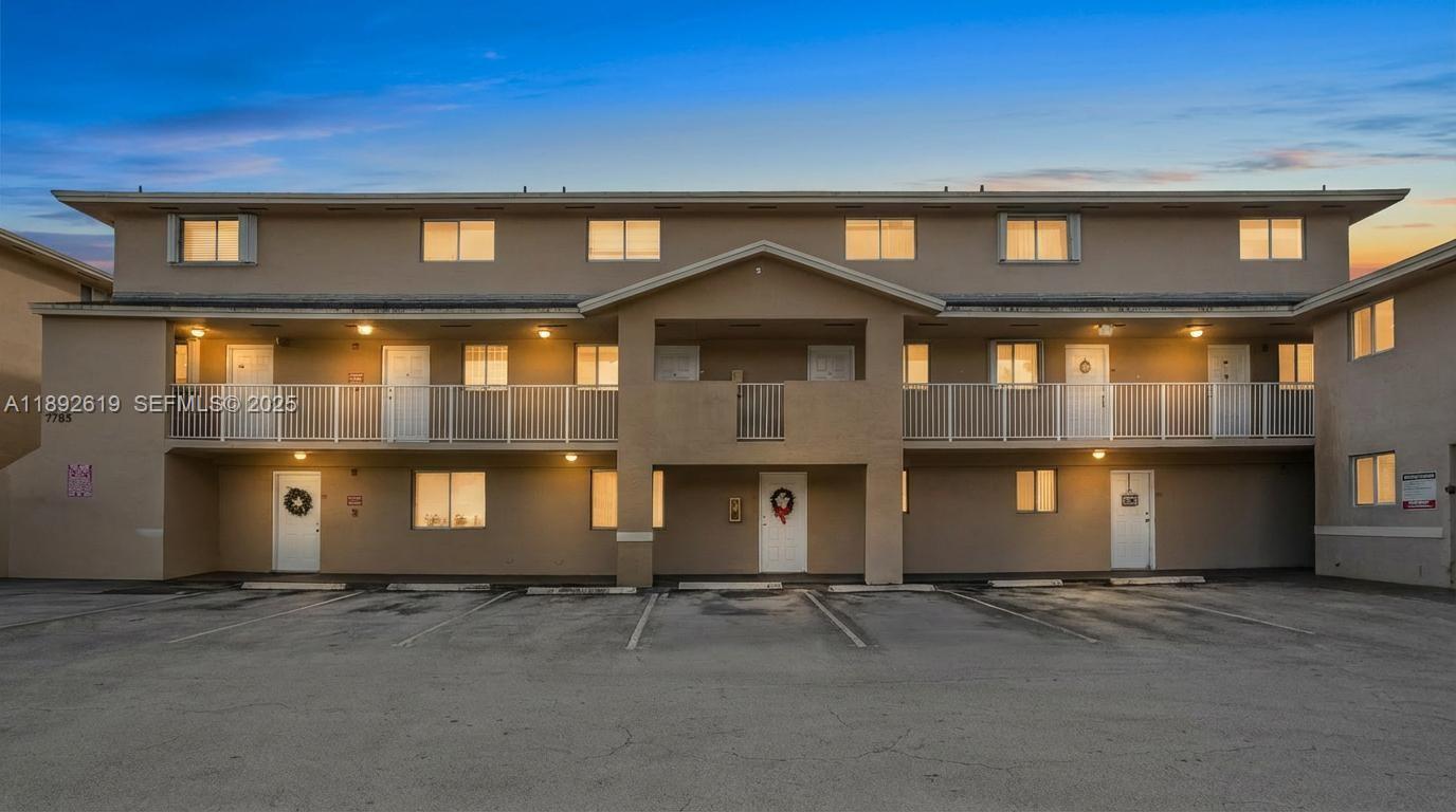 7785 West 30th Court, Unit F210 Hialeah, FL 33018 - Photo 1 of 21 a front view of a house