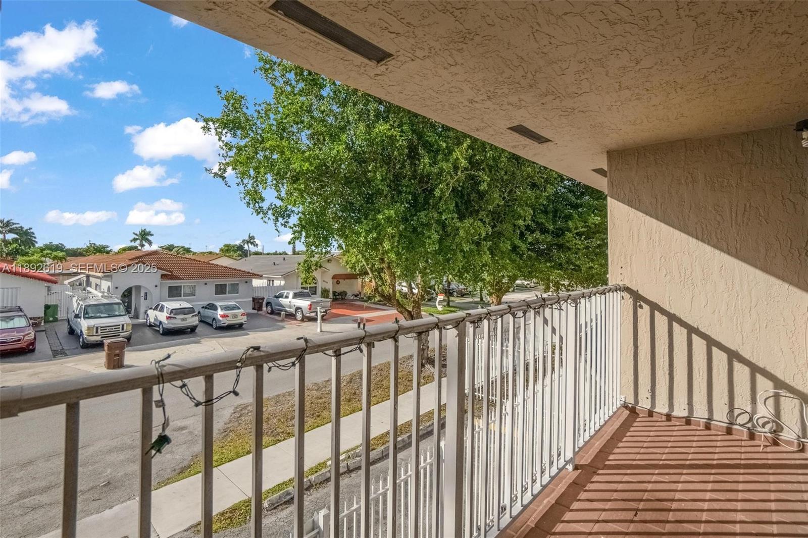 7785 West 30th Court, Unit F210 Hialeah, FL 33018 - Photo 17 of 21 a view of a street from a balcony
