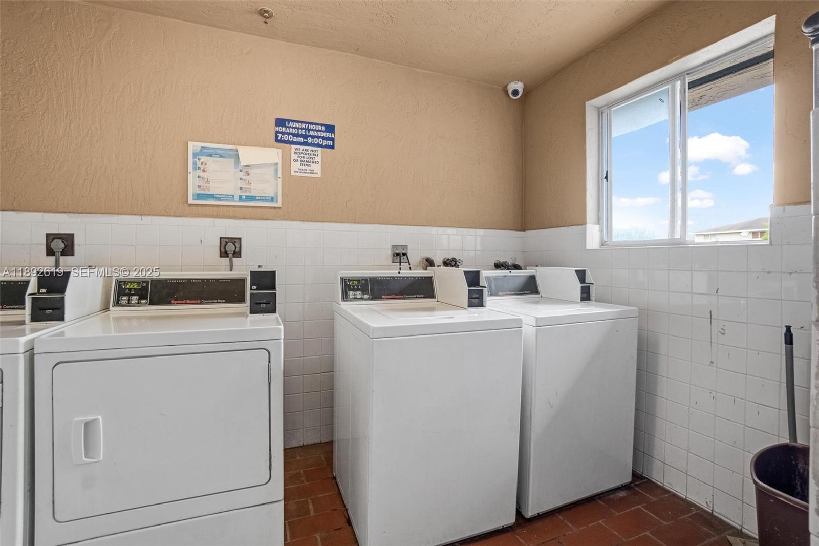 7785 West 30th Court, Unit F210 Hialeah, FL 33018 - Photo 18 of 21 a utility room with dryer and washer