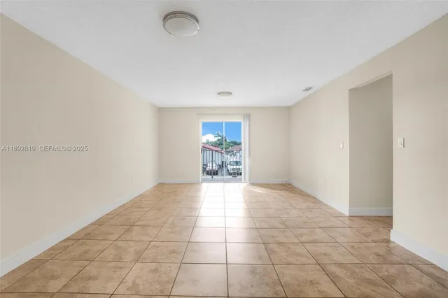 a view of an empty room and window