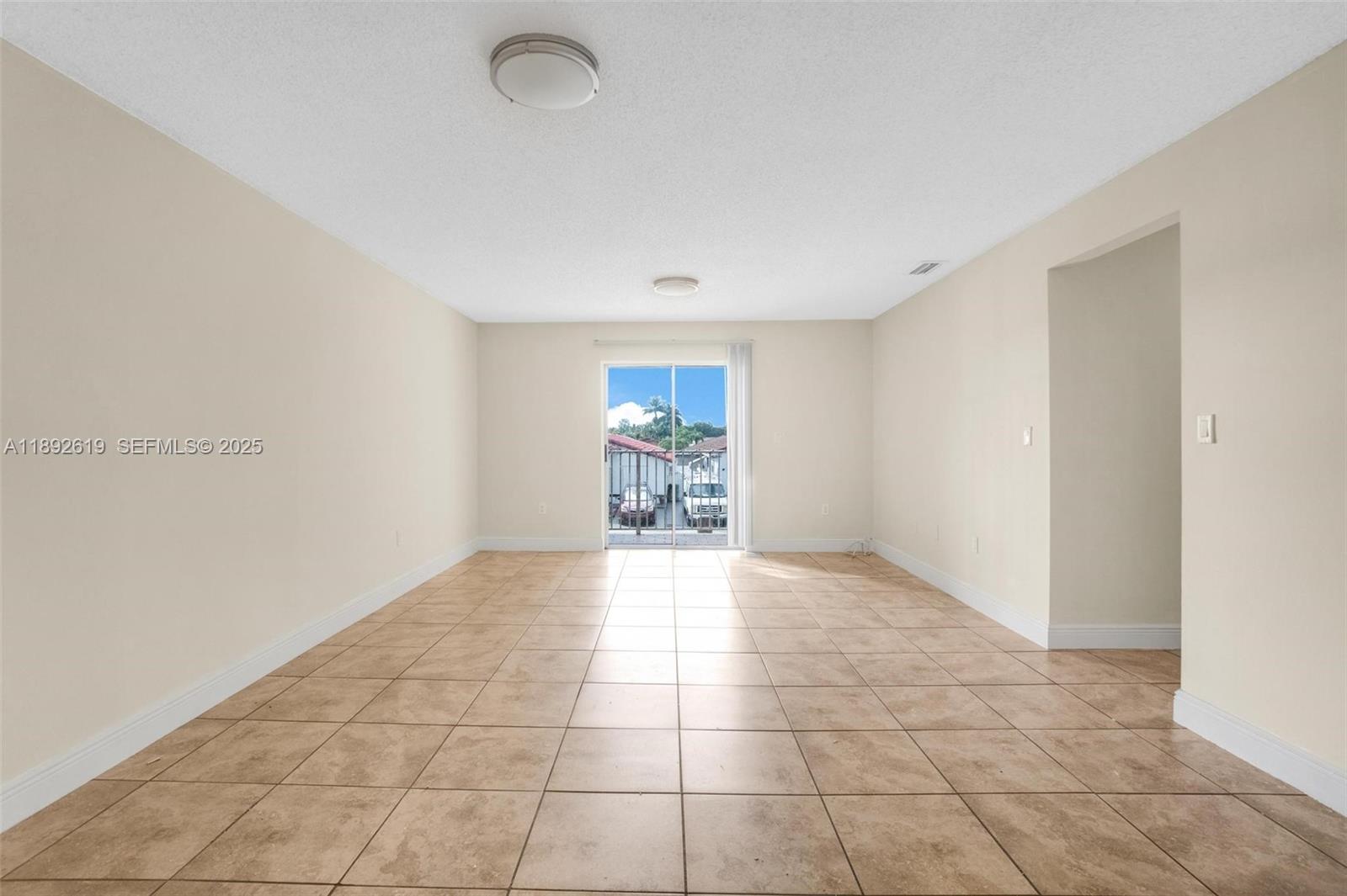 7785 West 30th Court, Unit F210 Hialeah, FL 33018 - Photo 6 of 21 a view of an empty room and window