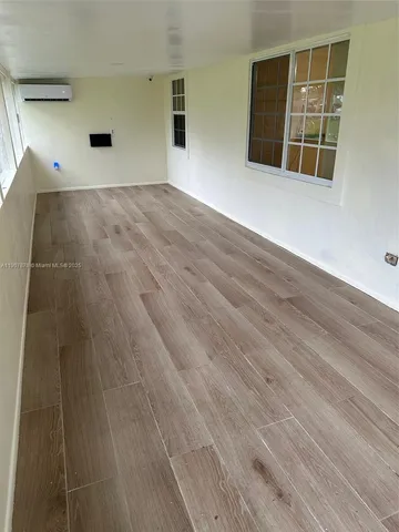 a view of a backyard with a small pool