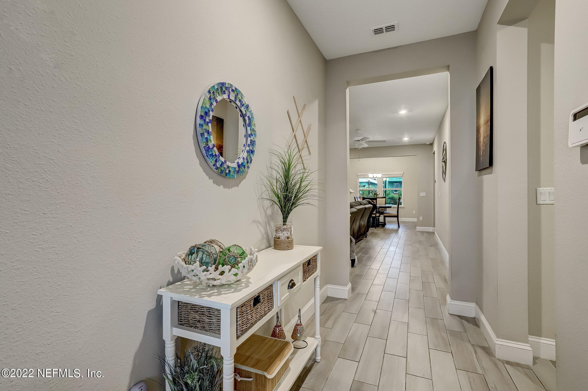2564 Alexia Circle Jacksonville, FL 32246 - Photo 11 of 67 a dining room with furniture and wooden floor