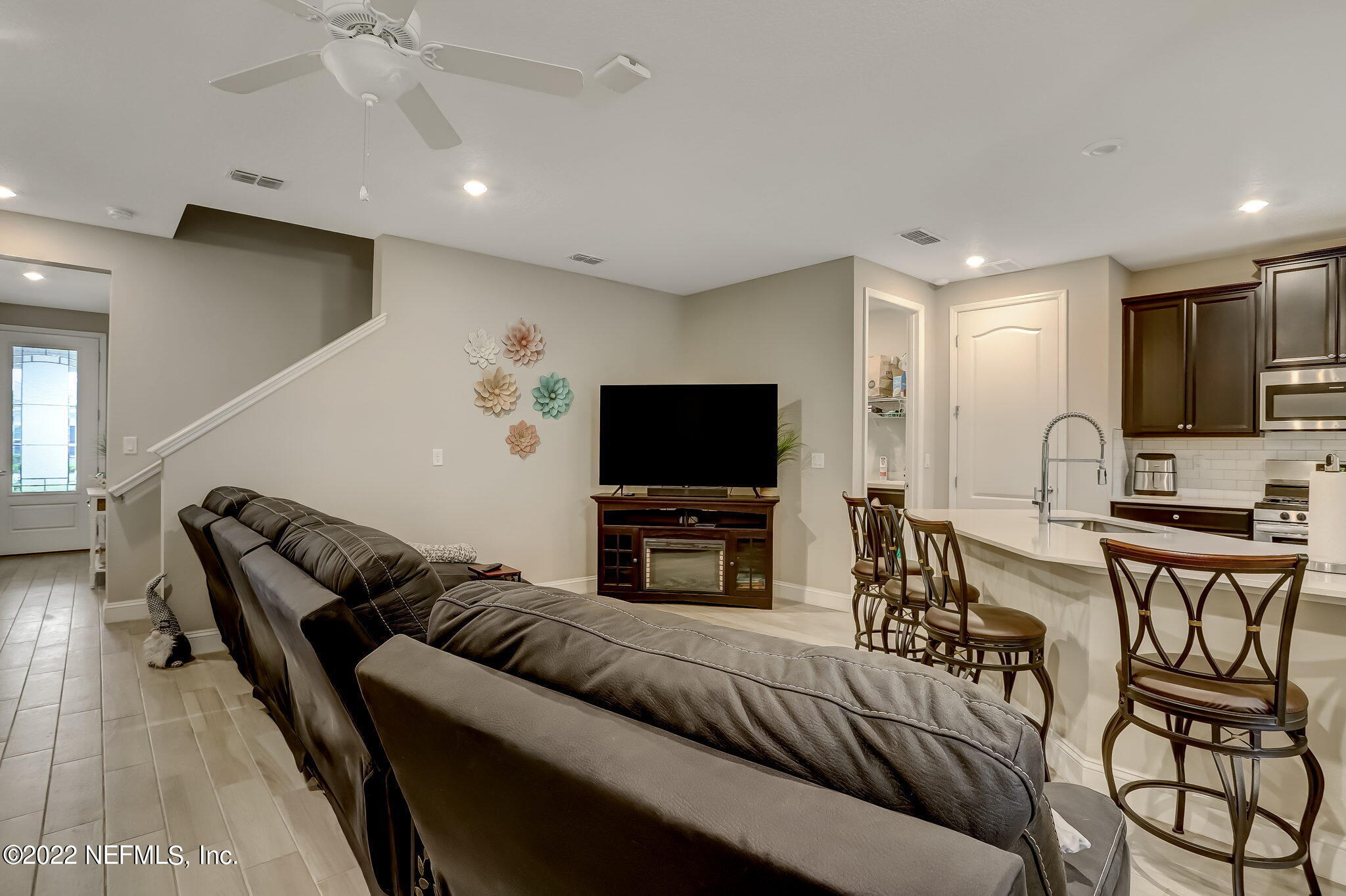 2564 Alexia Circle Jacksonville, FL 32246 - Photo 14 of 67 a living room with furniture and a flat screen tv