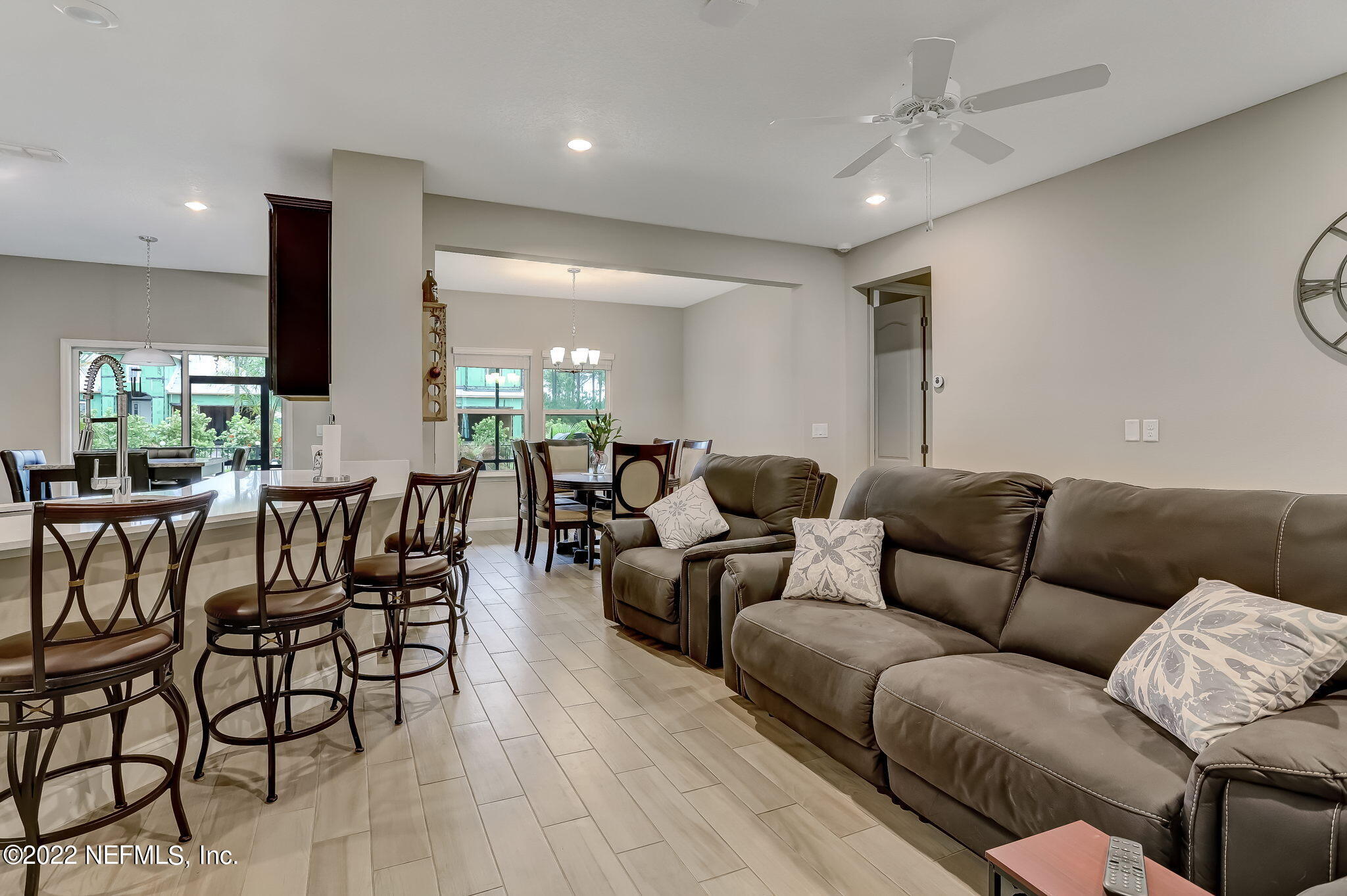 2564 Alexia Circle Jacksonville, FL 32246 - Photo 16 of 67 a living room with furniture kitchen view and a large window