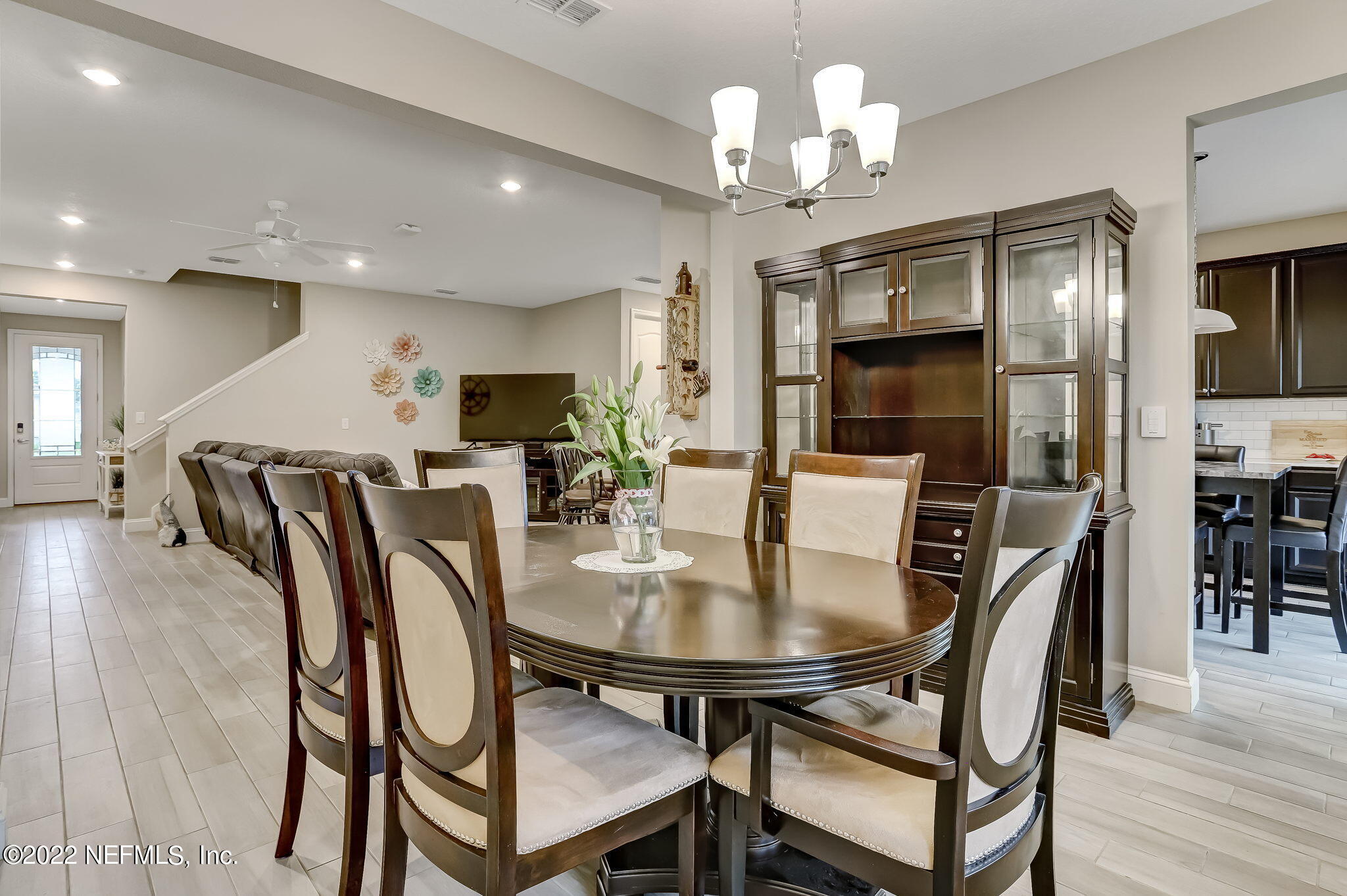 2564 Alexia Circle Jacksonville, FL 32246 - Photo 19 of 67 a view of a dining room with furniture and wooden floor