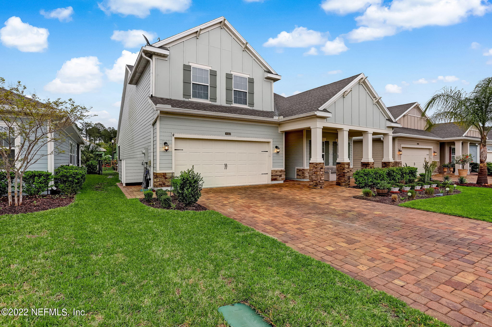 2564 Alexia Circle Jacksonville, FL 32246 - Photo 3 of 67 a front view of a house with a yard and garage