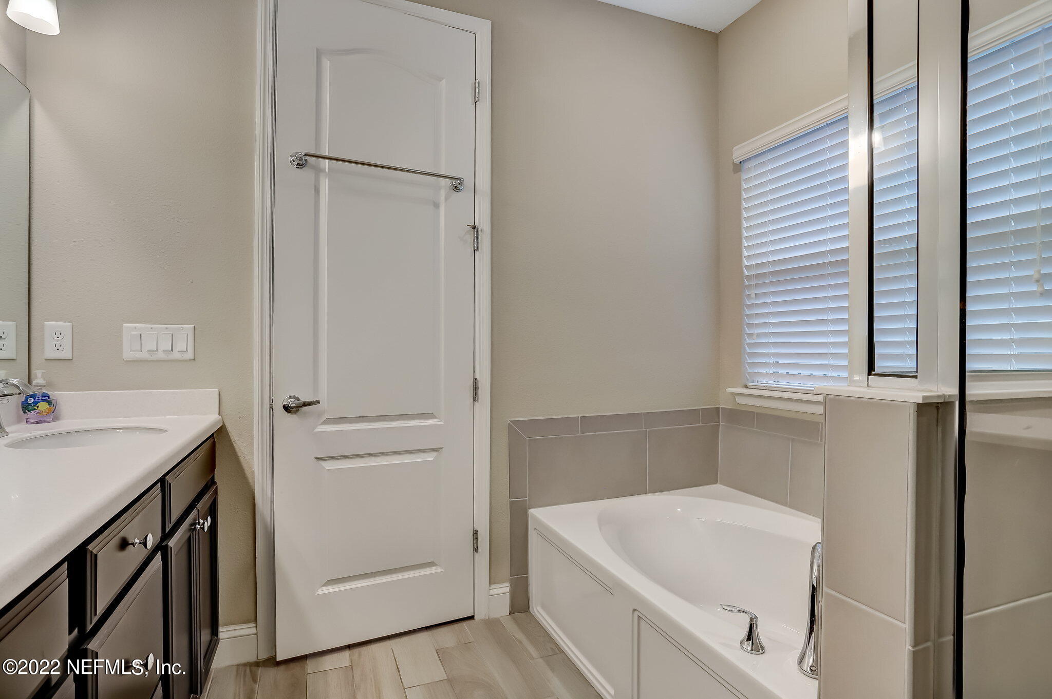 2564 Alexia Circle Jacksonville, FL 32246 - Photo 34 of 67 a bathroom with a sink a bath tub and a sink