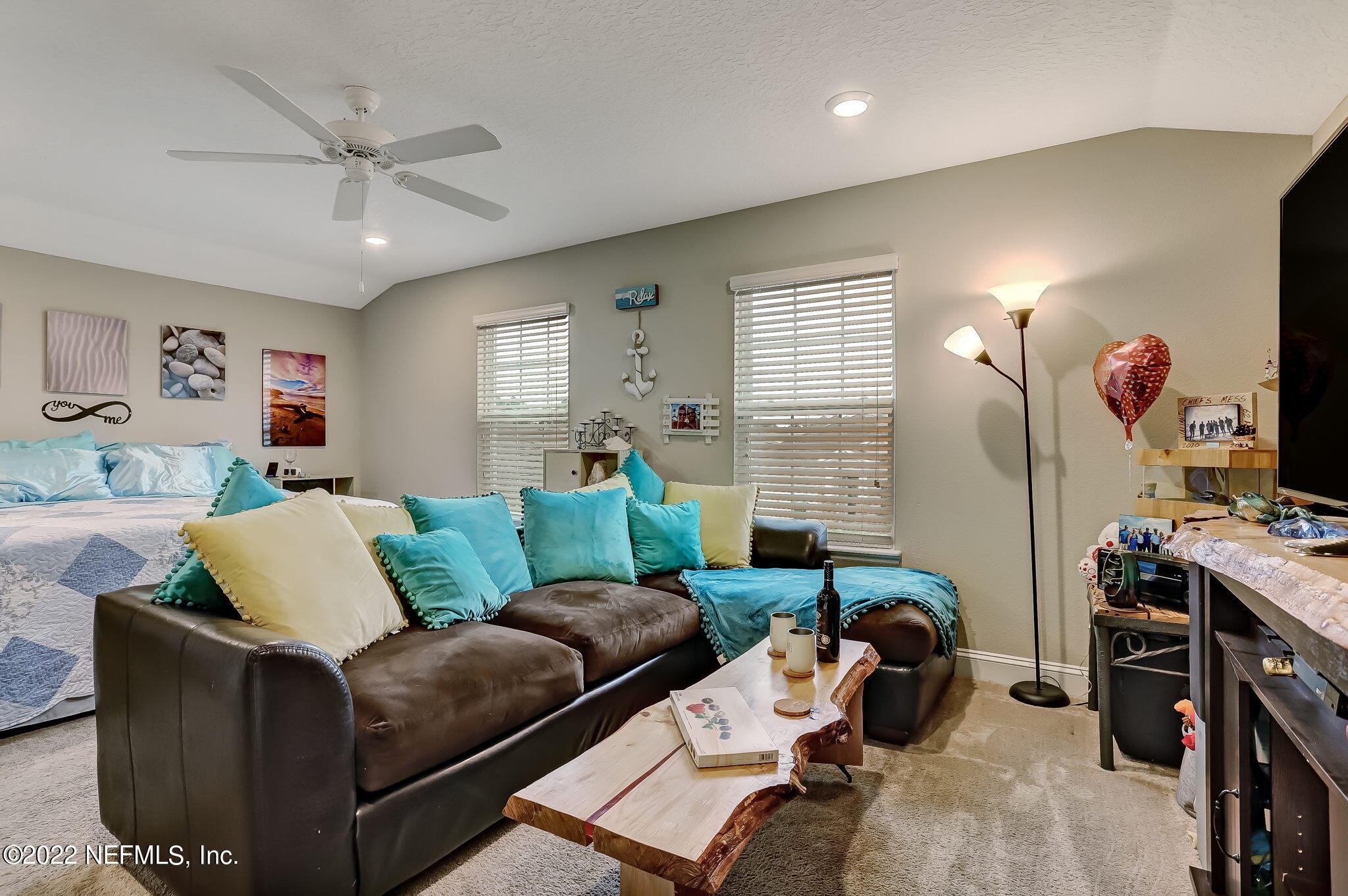 2564 Alexia Circle Jacksonville, FL 32246 - Photo 46 of 67 a living room with furniture and a flat screen tv