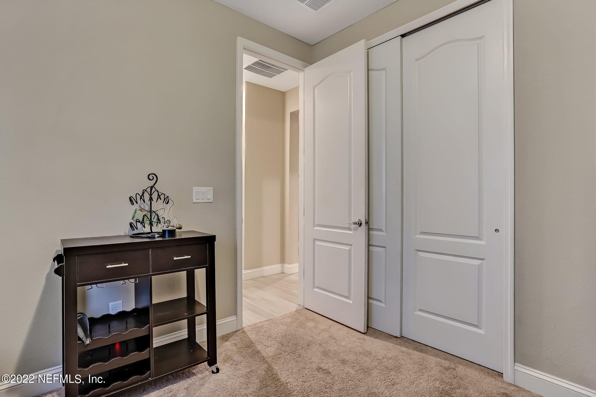 2564 Alexia Circle Jacksonville, FL 32246 - Photo 51 of 67 a room that has a dresser and a mirror