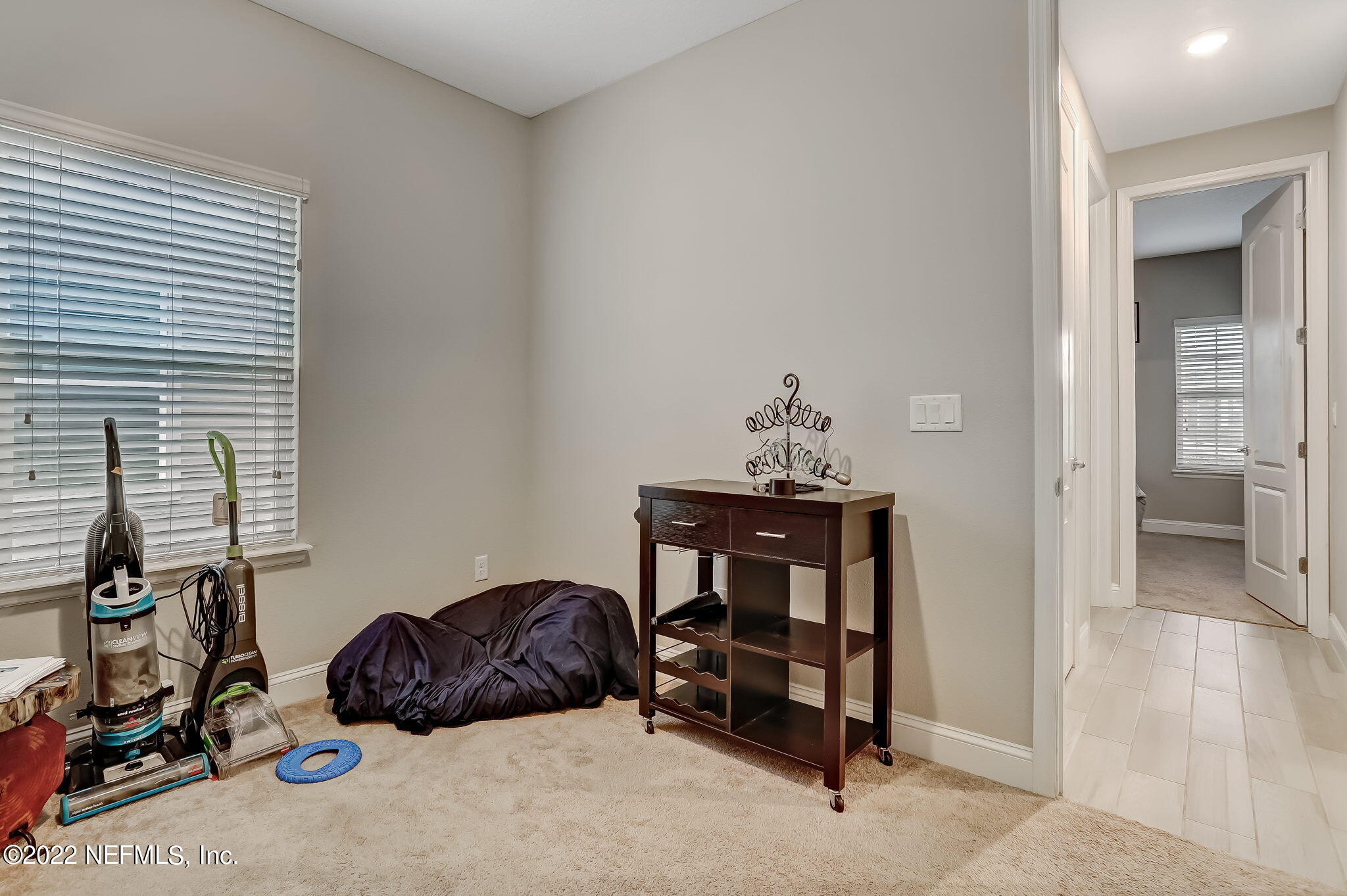 2564 Alexia Circle Jacksonville, FL 32246 - Photo 53 of 67 a bedroom with a bed and a desk