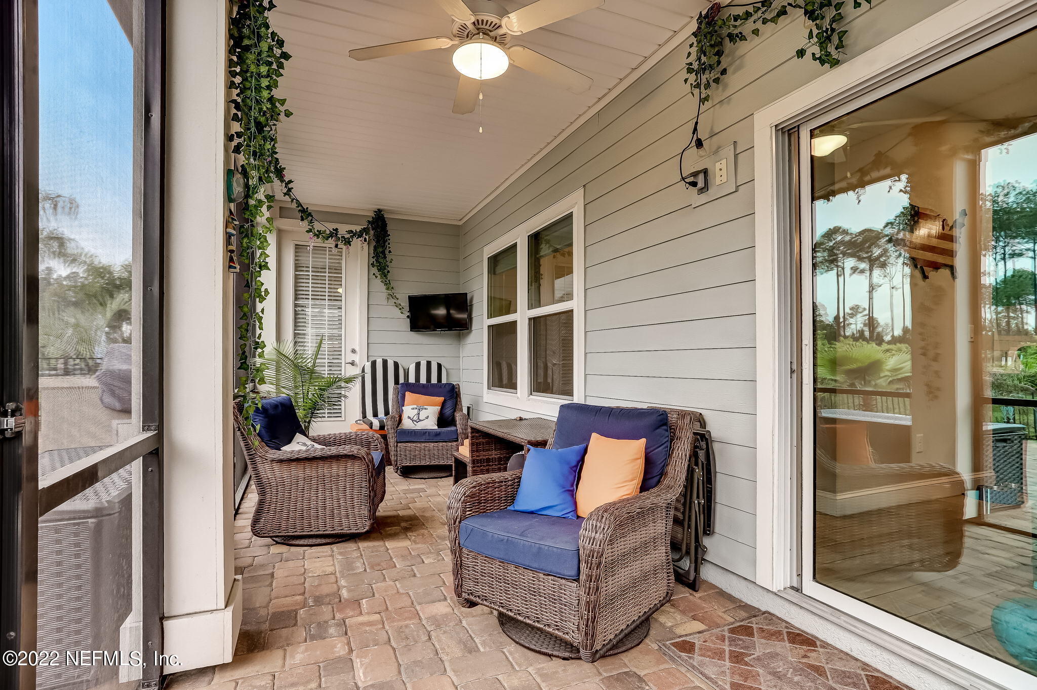 2564 Alexia Circle Jacksonville, FL 32246 - Photo 54 of 67 a outdoor living space with furniture and a potted plant