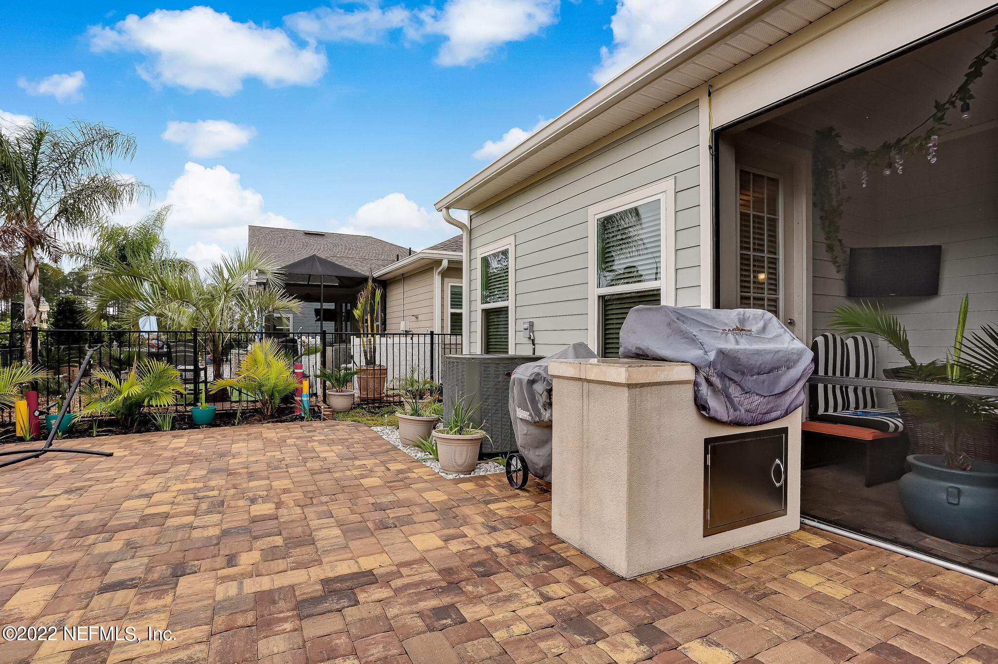 2564 Alexia Circle Jacksonville, FL 32246 - Photo 60 of 67 a view of a patio with a dining table and chairs
