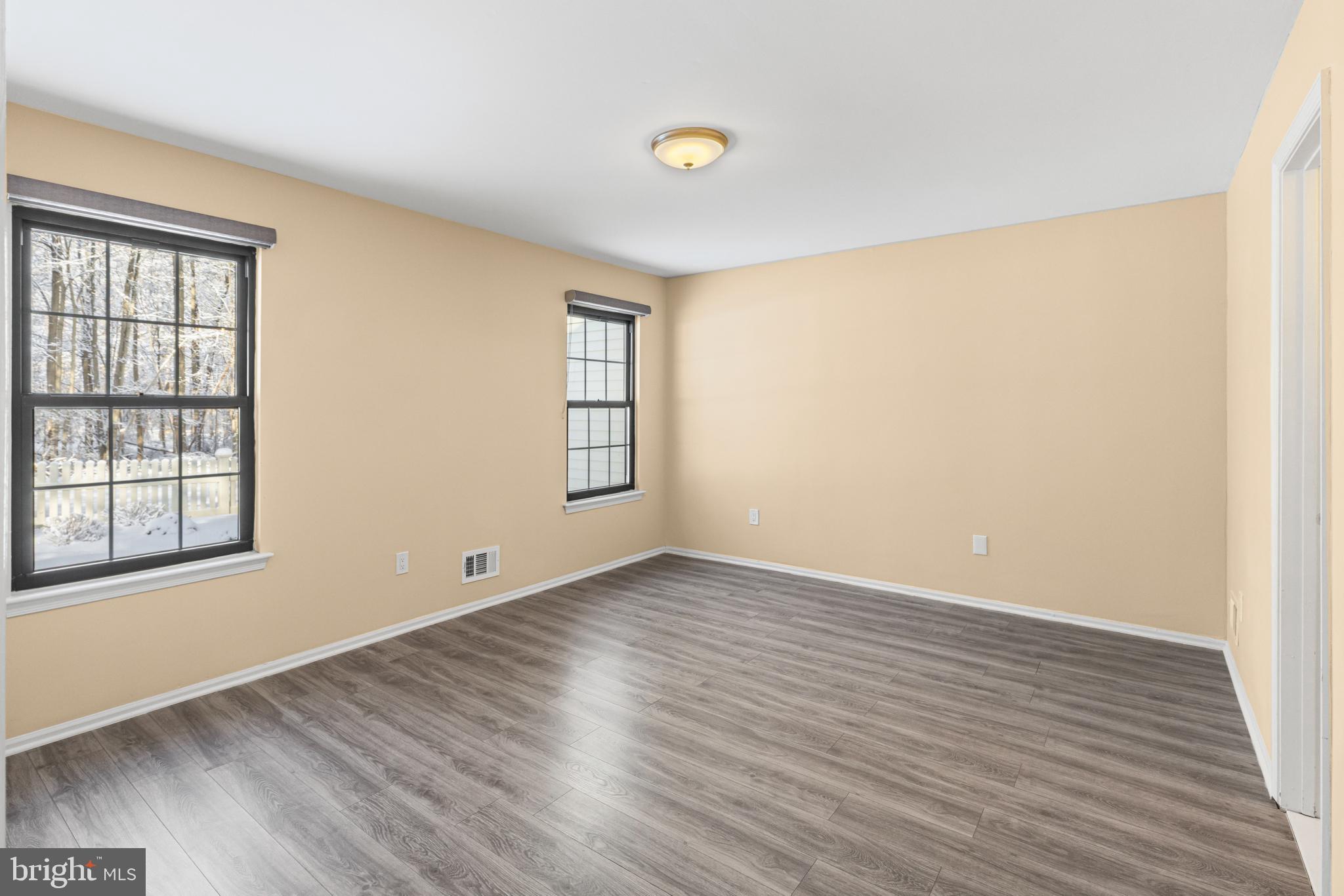 9 Devon Court Robbinsville, NJ 08691 - Photo 13 of 22 an empty room with wooden floor and windows