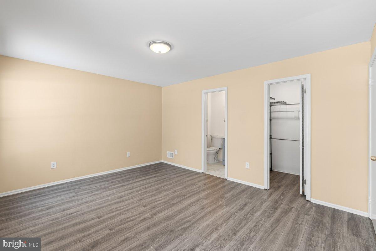 9 Devon Court Robbinsville, NJ 08691 - Photo 14 of 22 a view of an empty room with wooden floor