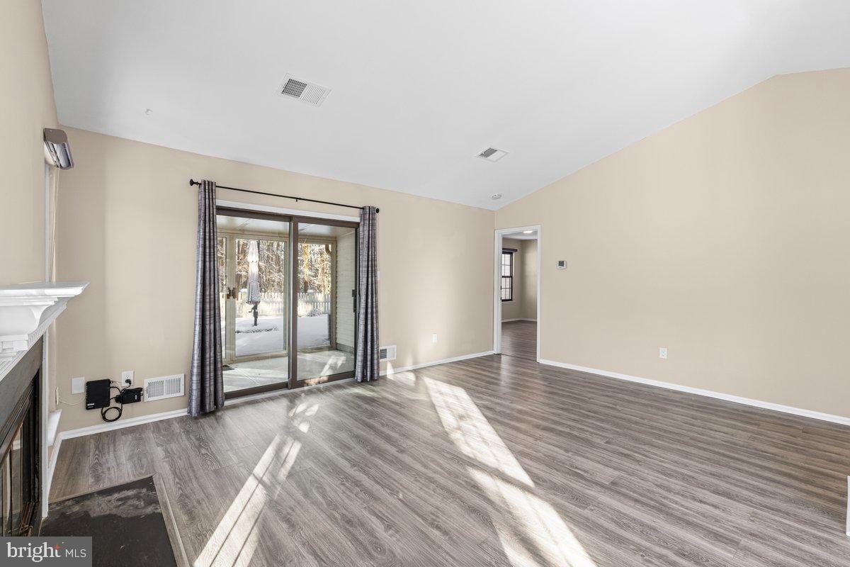 9 Devon Court Robbinsville, NJ 08691 - Photo 3 of 22 a view of livingroom with hardwood floor and a ceiling fan