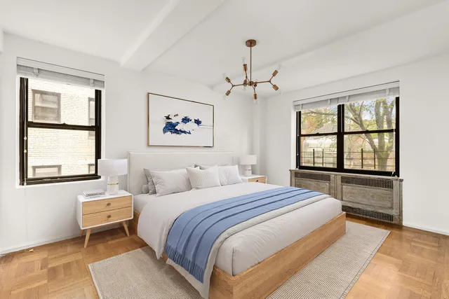 a spacious bedroom with a bed and a window