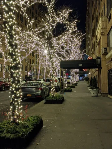 a view of street with parked cars
