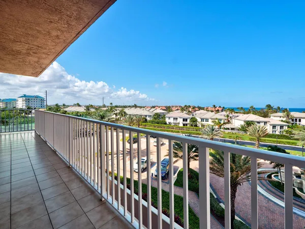 a view of a balcony with chairs