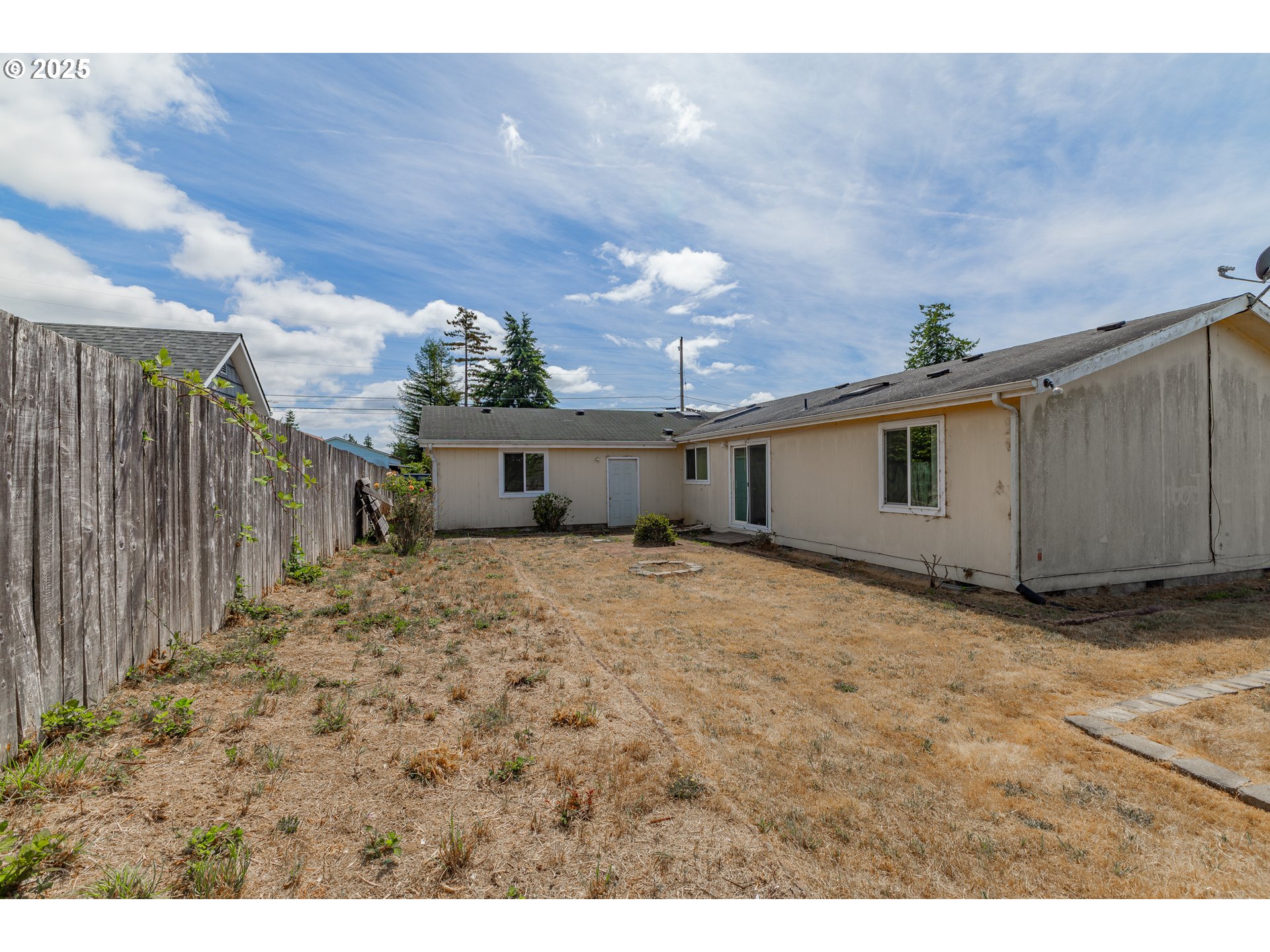 1829 East Willow Street Myrtle Point, OR 97458 - Photo 31 of 37 a view of a backyard of the house