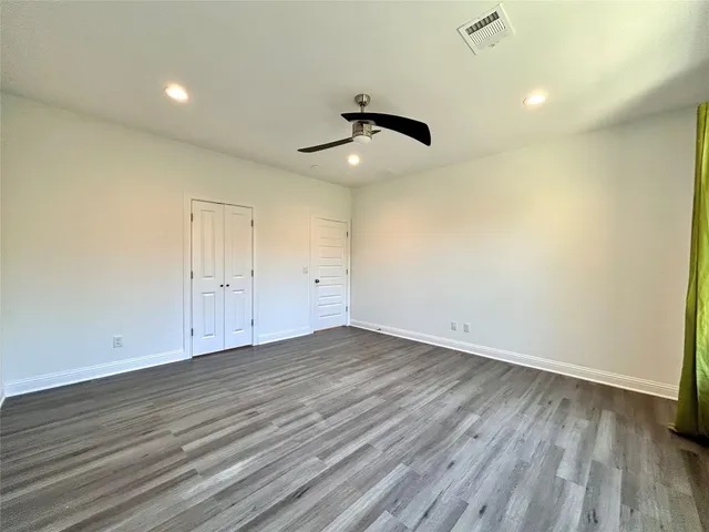 a view of kitchen with furniture and a ceiling fan