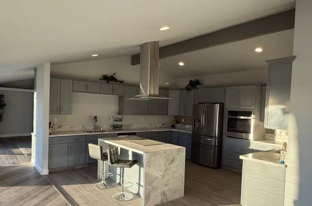 a kitchen with stainless steel appliances a refrigerator and a stove