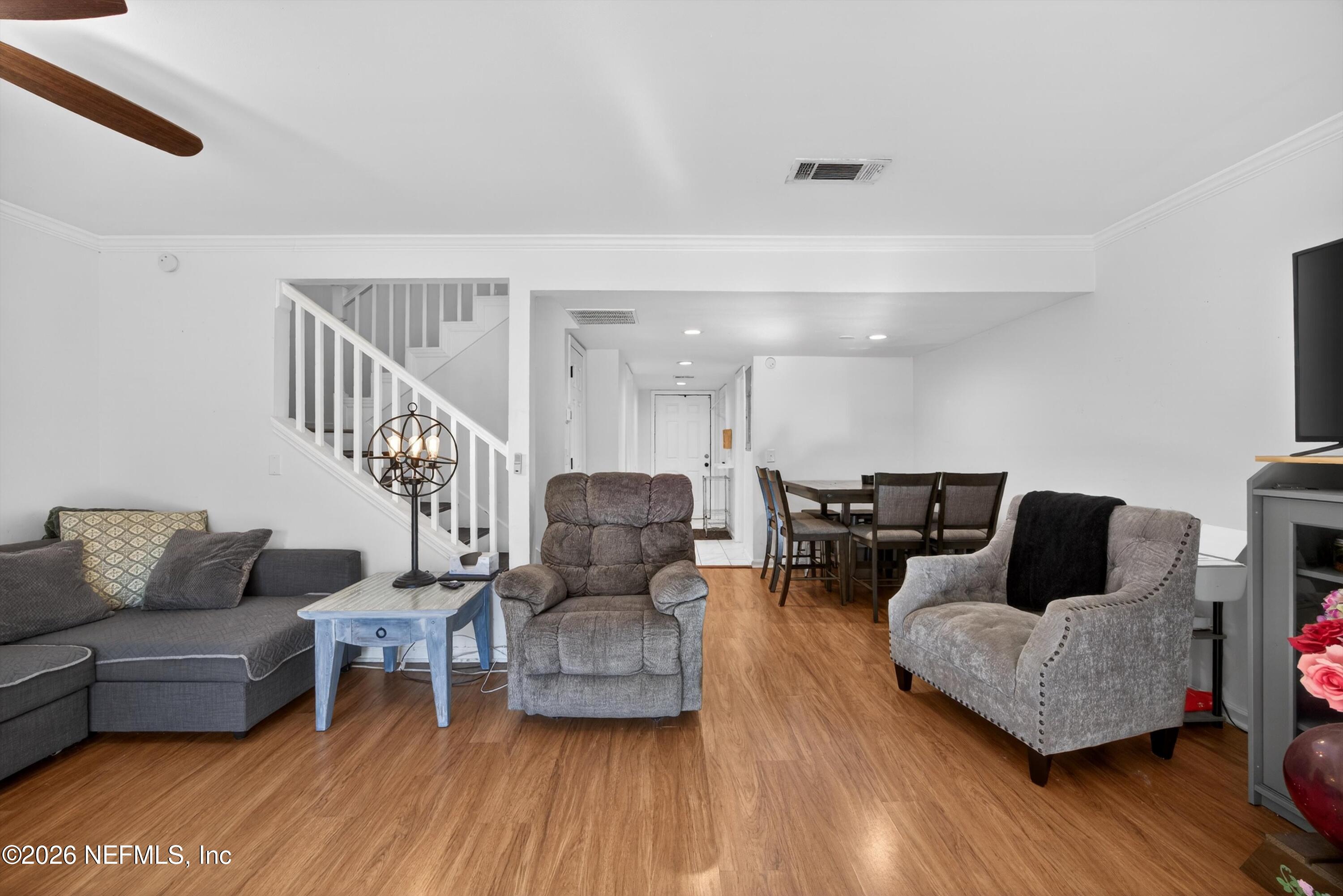 8880 Old Kings Road South, Unit 2 Jacksonville, FL 32257 - Photo 15 of 35 a living room with furniture and a wooden floor