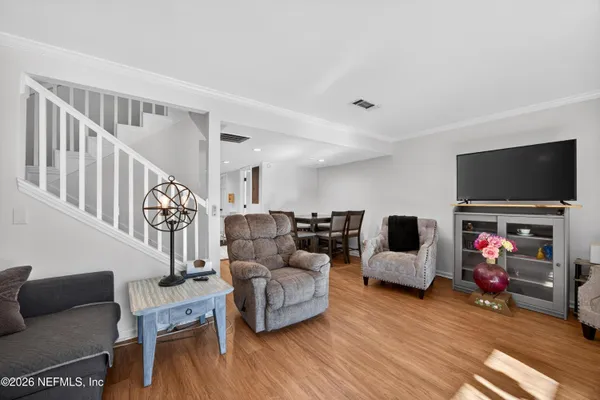 a living room with furniture and a flat screen tv