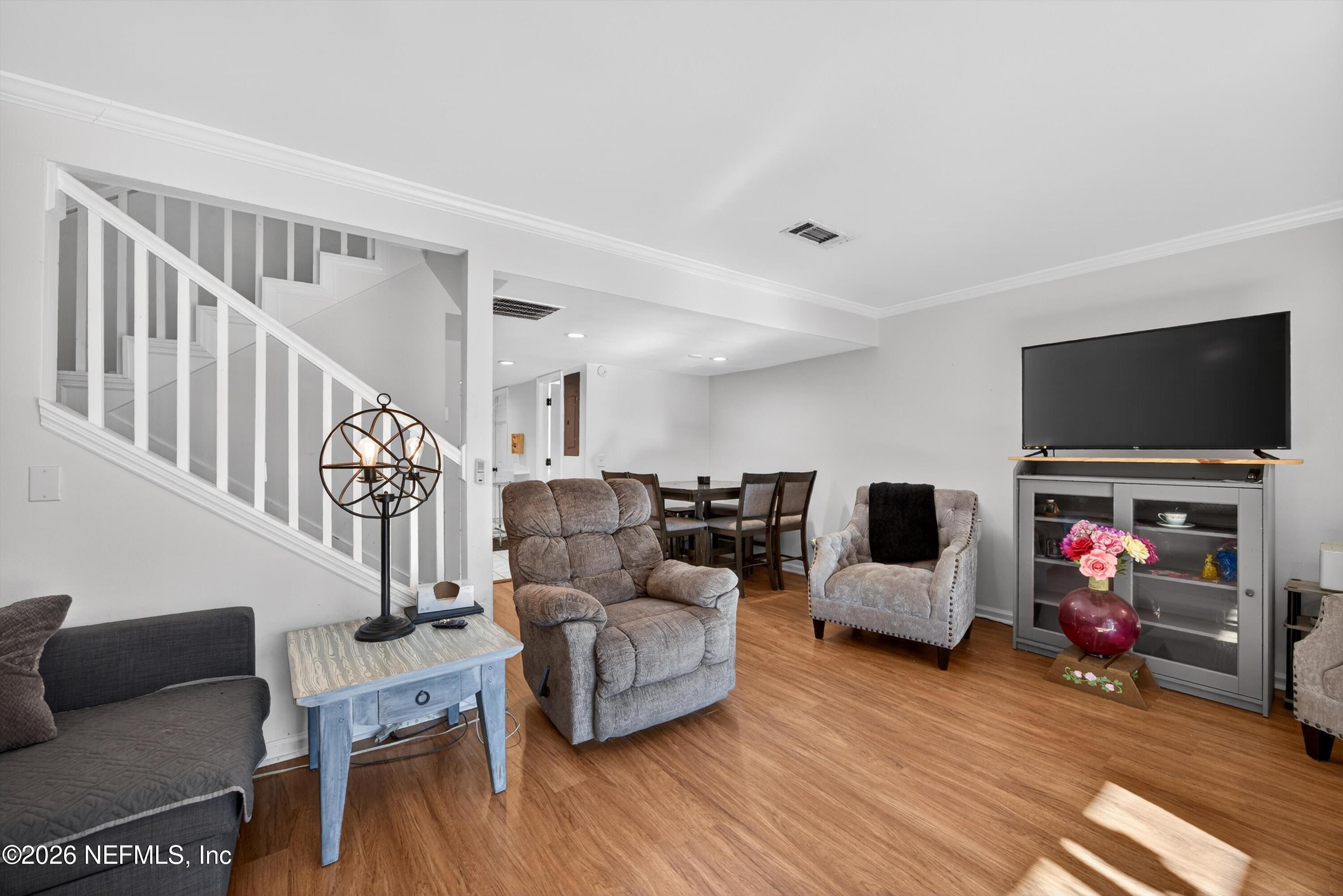 8880 Old Kings Road South, Unit 2 Jacksonville, FL 32257 - Photo 16 of 35 a living room with furniture and a flat screen tv