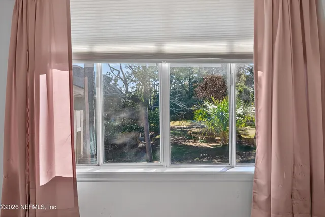 a view of a room that has a large window