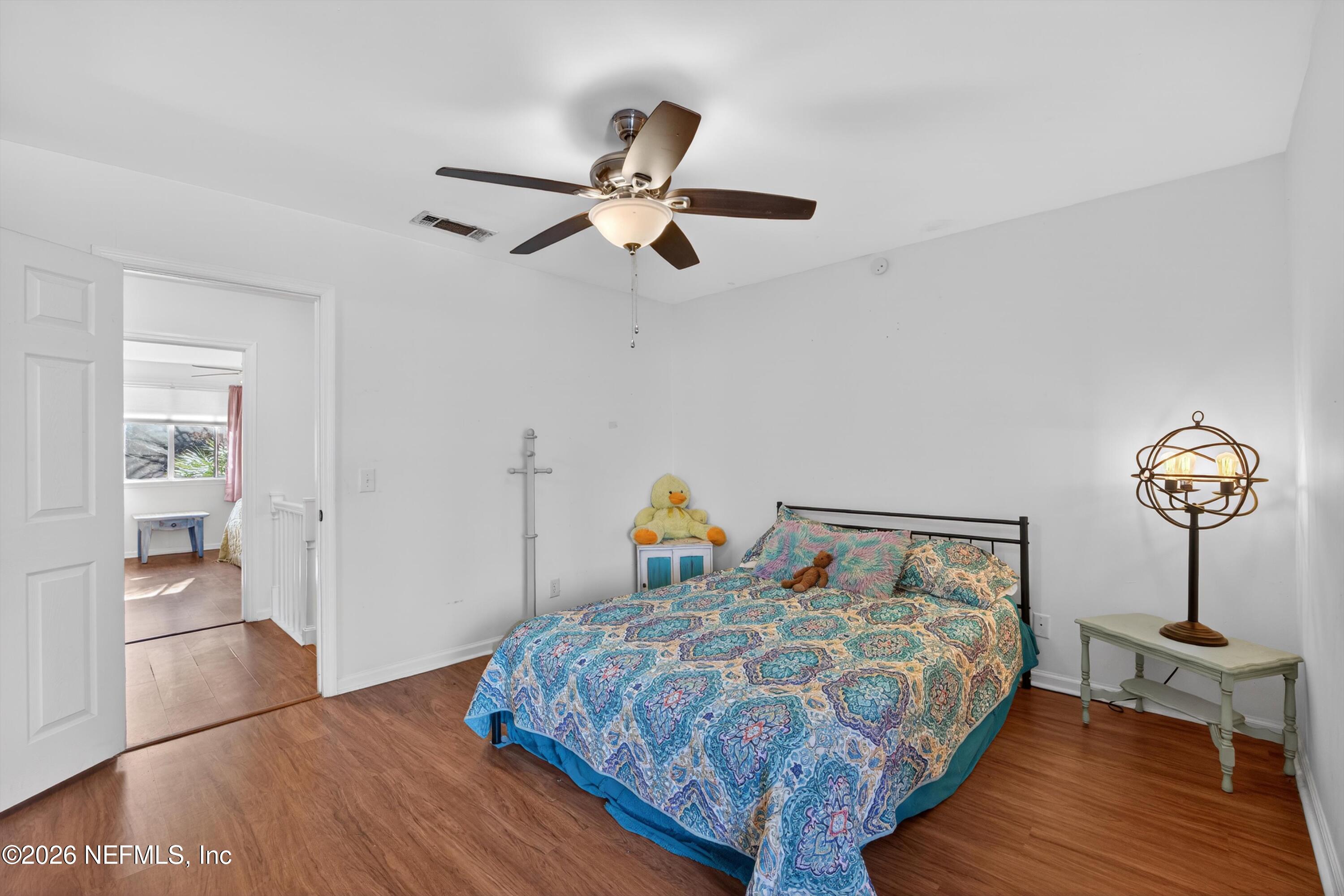 8880 Old Kings Road South, Unit 2 Jacksonville, FL 32257 - Photo 25 of 35 a bedroom with bed and wooden floor