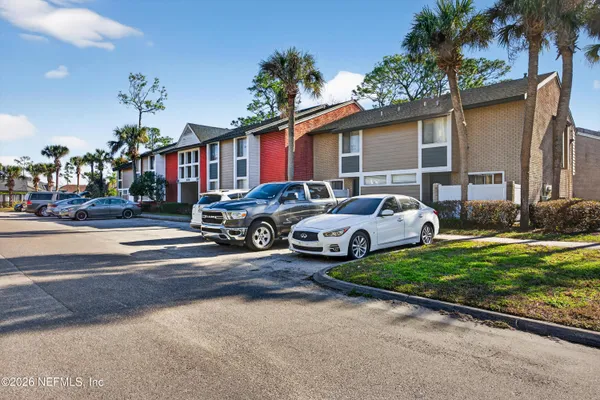 a group of cars parked in front of a house