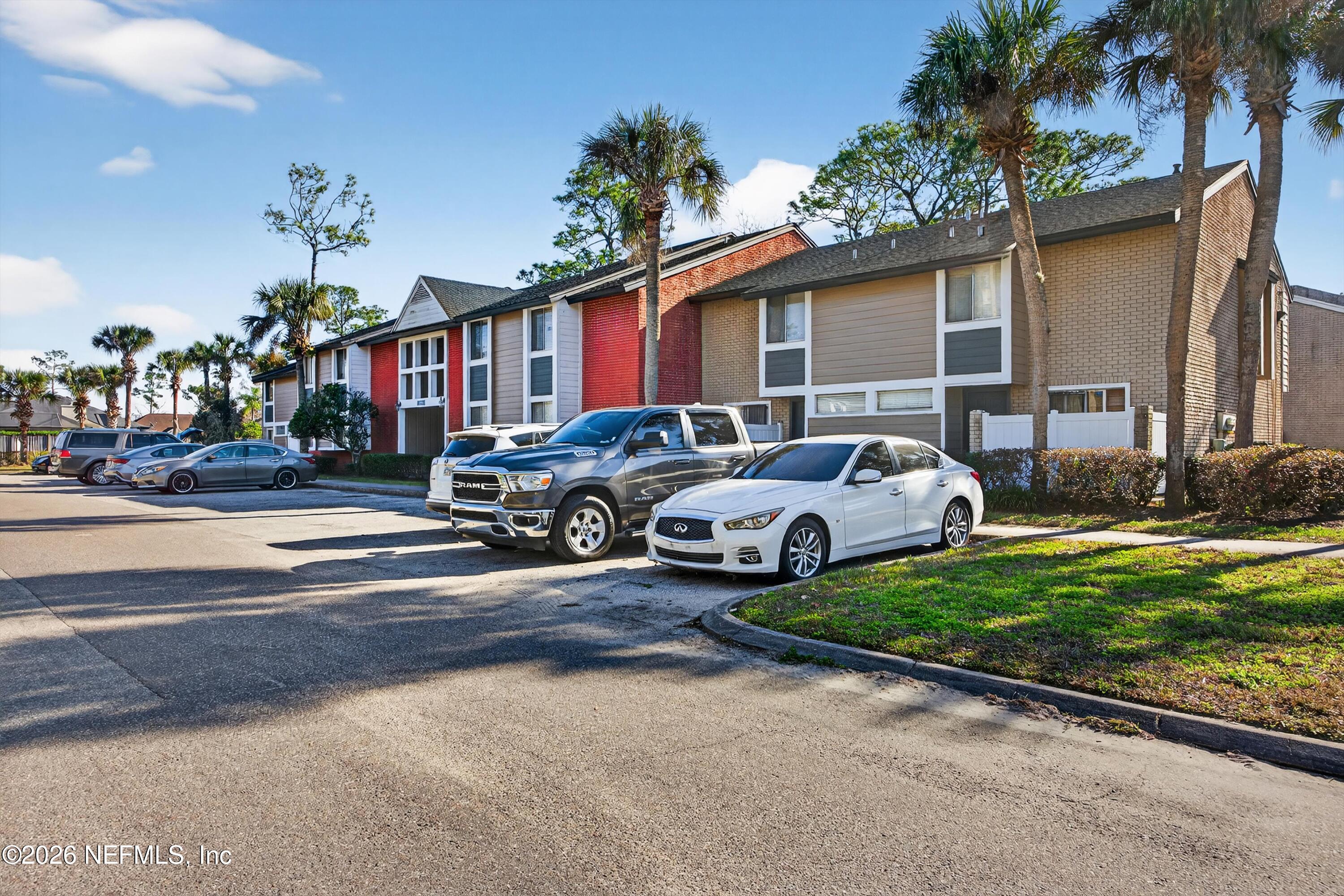 8880 Old Kings Road South, Unit 2 Jacksonville, FL 32257 - Photo 3 of 35 a group of cars parked in front of a house
