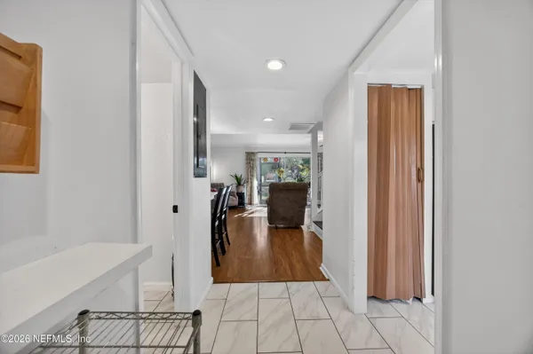 a view of a living room and bathroom