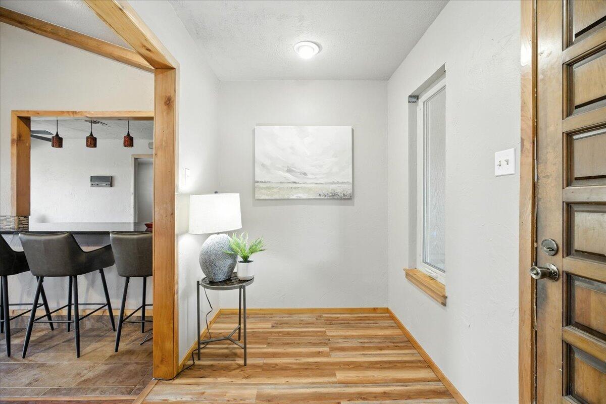5726 67th Street Lubbock, TX 79424 - Photo 12 of 26 a view of a hallway with furniture and a potted plant