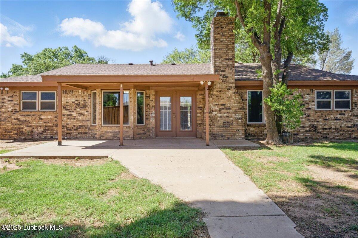 5726 67th Street Lubbock, TX 79424 - Photo 23 of 26 front view of a house with a yard