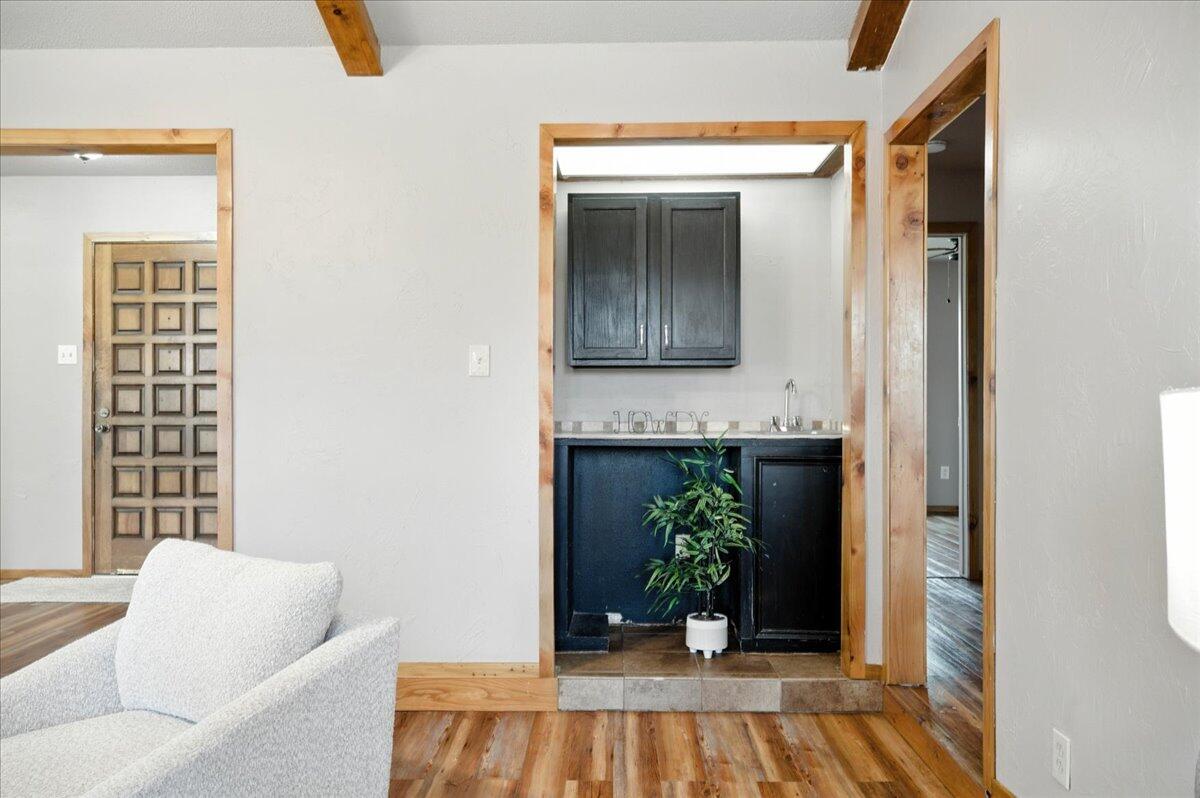 5726 67th Street Lubbock, TX 79424 - Photo 6 of 26 a living room with furniture and a potted plant