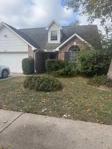 a view of a backyard of a house