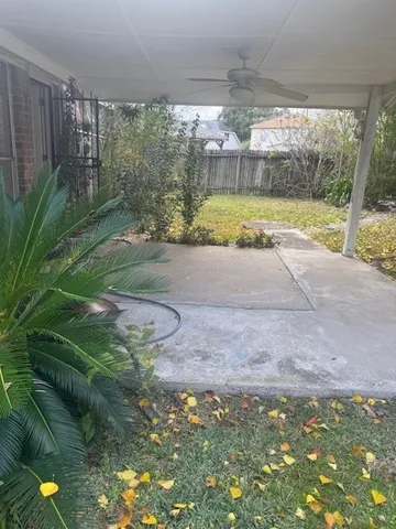 a view of a room with wooden floor and a window
