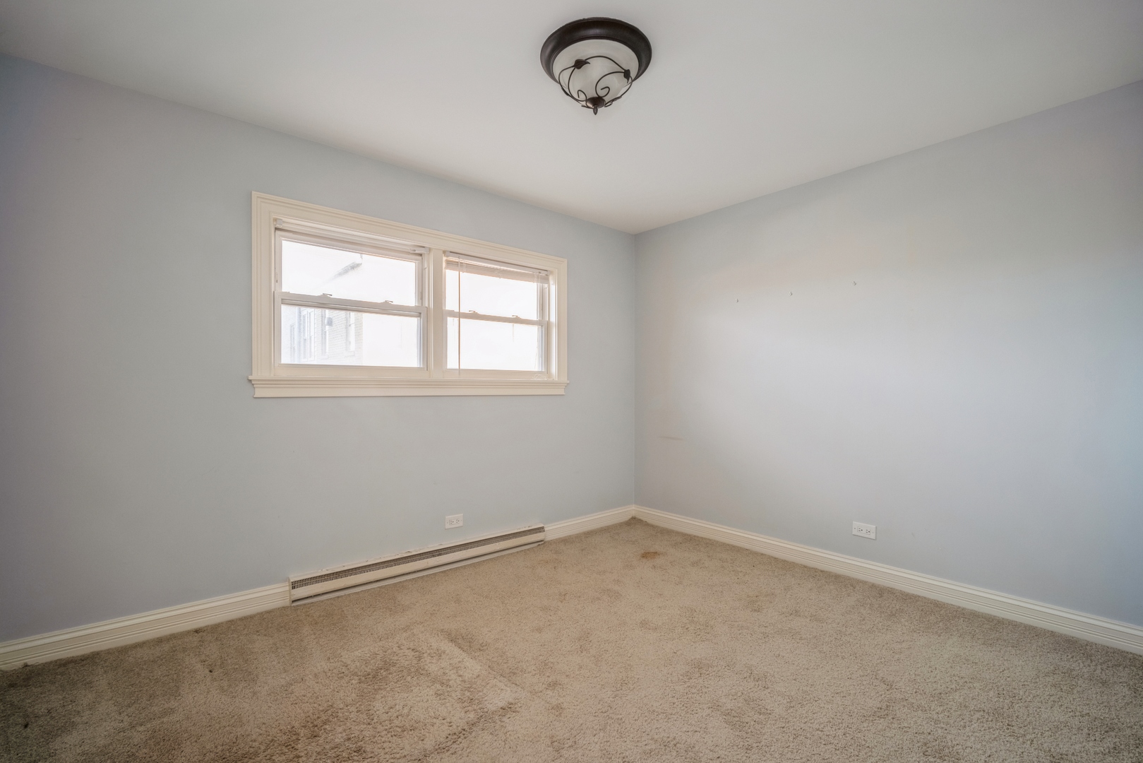 1345 1st Street, Unit 1345 Northbrook, IL 60062 - Photo 7 of 10 an empty room with a window
